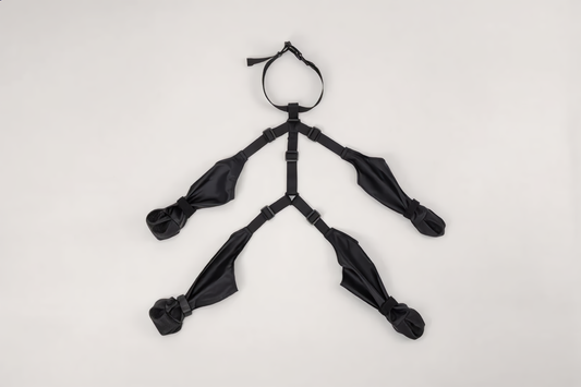 The Haven Boots laid flat, all four boots joined by the collar strap